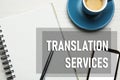 Translation services. Flat lay composition with notebook on white wooden table Royalty Free Stock Photo