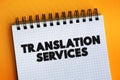 Translation Services text on notepad, business concept background