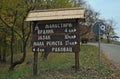 Wooden sign with distances to monasteries at Fruska Gora mountain, Serbia