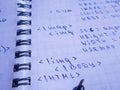 Translations of calculus systems on a notebook and black pen. creation of computer programs. work of the programmer and system
