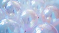 Translucent balloons filled with iridescence and reflective sparkles bring a light, ethereal quality to celebrations