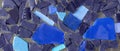 Translucent blue and dark violet stones on a silver metallic background. Royalty Free Stock Photo