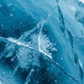 Translucent blue ice featuring intricate cracks and patterns. Small air bubbles are Royalty Free Stock Photo