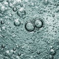 Translucent bubbles of various sizes are suspended in a clear liquid Royalty Free Stock Photo