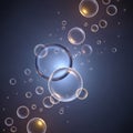 Translucent bubbles of varying sizes float against a dark blue background. Larger bubbles are Royalty Free Stock Photo