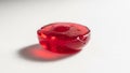 Translucent candy in focus shaped like a flattened disc with a glossy Royalty Free Stock Photo