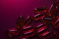 Capsules under dark red lighting Royalty Free Stock Photo