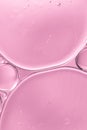 translucent oil drops water soft pink blurred background. High quality photo Royalty Free Stock Photo