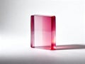 Translucent pink rectangular block standing on a white background. Minimalist geometric object made of glass, acrylic or resin Royalty Free Stock Photo