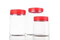 Translucent plastic PVC jar with red cover isolated in white