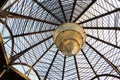 Translucent roof or ceiling dome reflecting with morning sunlight golden steel and spiral lamp in modern and contemporary