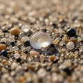 Translucent spherical piece possibly glass or a smooth pebble surrounded by Royalty Free Stock Photo