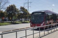 A Transmilenio bus in movement transitin over North highway in sunny day