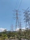 Transmission of electricity by air. 500KV and 150KV power distribution cable towers Royalty Free Stock Photo