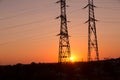 Transmission power line silhouette on sunset Royalty Free Stock Photo