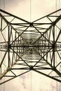 Transmission tower bottom view. Power tower on cloudy sky. Electricity pylon structure for power line. High voltage post Royalty Free Stock Photo