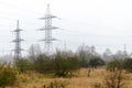 A transmission tower or electricity pylon. Steel lattice tower, used to support an overhead power line. The sky is covered with Royalty Free Stock Photo