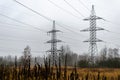 A transmission tower or electricity pylon. Steel lattice tower, used to support an overhead power line. The sky is covered with Royalty Free Stock Photo