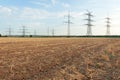Transmission tower overhead line masts, a lot of high-voltage power line, high voltage pylons also known as power pylons on the fi Royalty Free Stock Photo
