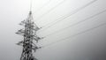 Transmission tower silhouette in deep mist white background Royalty Free Stock Photo