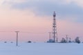 Transmission tower in winter, Telecommunications tower with cellular antenna Royalty Free Stock Photo