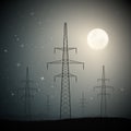 Transmission towers on moonlight starry night. Industrial landscape