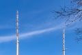 Transmission towers for the transmission of television, radio and mobile in front of a bright blue sky