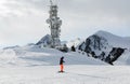A transmitter at the top of a mountain in the Dolomites ski area. Empty ski slope in winter on a sunny day. Prepare ski slope, Alp