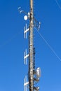 Transmitter tower against cloudless blue sky Royalty Free Stock Photo