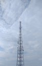 A transmitter tower that towers over the village area.