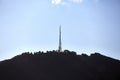 Transmitter towers on a hill, blue sky Royalty Free Stock Photo