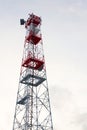 Transmitters and aerials on telecommunication tower, sunset in snowy country Royalty Free Stock Photo