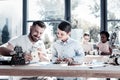 Joyful teacher and student smiling while working on robotic machine Royalty Free Stock Photo