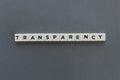 Transparency word made of square letter word on grey background. Royalty Free Stock Photo