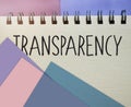 Transparency word written on copybook page . transparency text on table, concept