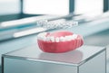 Transparent aligner orthodontic device above teeth cast