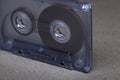 Transparent audio cassette tape orange background. Front, view