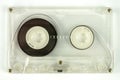 Transparent audio cassette on white background