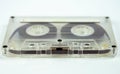 Transparent audio cassette on white background