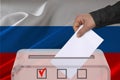 Transparent ballot box for voting with ballot in front Russia national flag, Election Process and Democracy, Fair Elections and Royalty Free Stock Photo