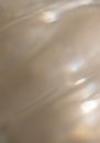 Transparent beige clean surface with a natural rippled background. Texture of water with ripples. Royalty Free Stock Photo