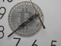 Transparent Bitcoin on clock Royalty Free Stock Photo