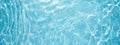 Transparent blue clear water surface texture with ripples, splashes and bubbles Royalty Free Stock Photo