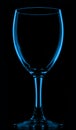 Transparent blue empty wine glass on black