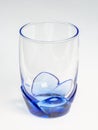Transparent blue glass with flower-style base Royalty Free Stock Photo