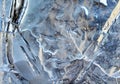 Transparent blue surface of ice speckled with white cracks Royalty Free Stock Photo