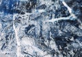 Transparent blue surface of ice speckled with white cracks Royalty Free Stock Photo
