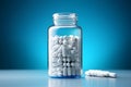 Transparent bottle filled with white capsules against a blue harmony backdrop Royalty Free Stock Photo