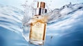 A transparent bottle of unisex perfume submerged in water Royalty Free Stock Photo