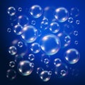 Transparent bubbles over dark blue